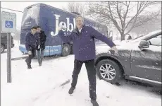  ?? STEVEN SENNE/ASSOCIATED PRESS ?? Republican presidenti­al candidate Jeb Bush throws a snowball af ter a campaign event in Nashua, N.H. Bush needs a boost from New Hampshire voters.