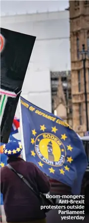  ??  ?? Doom-mongers: Anti-Brexit protesters outside Parliament yesterday