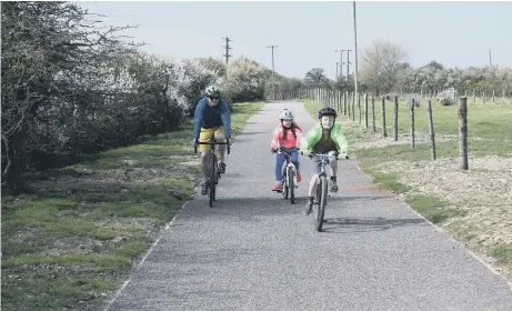  ??  ?? Enjoying the new cycle route that links Pagham Nature Reserve with Medmerry Nature Reserve