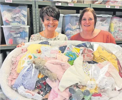  ?? ?? Kim Evans (left), a volunteer at Brierley Hill Babybank, with project worker Tracey Holdnall