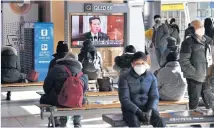  ?? ?? People at a Seoul railway station watch a television programme showing North Korean leader Kim Jong Un addressing a meeting of the Central Committee of the Workers’ Party on Jan 1.