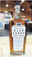  ??  ?? This Wednesday, May 3, photo shows a bottle of Glen Fargo American Malt Whiskey at Happy Harry’s Bottle Shop in Fargo, N.D. Proof Artisan Distillers received approval from the US Patent and Trademark Office for its Glen Fargo American Malt Whiskey...