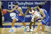  ?? ASSOCIATED PRESS FILE PHOTO ?? Drake forward Tremell Murphy, left, drives past Illinois State forward Abdou Ndiaye (4) during the second half of an NCAA college basketball game in Des Moines, Iowa.