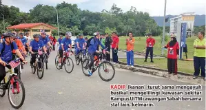  ??  ?? KADIR (kanan) turut sama mengayuh basikal mengelilin­gi kawasan sekitar Kampus UiTM cawangan Sabah bersama staf lain, kelmarin.