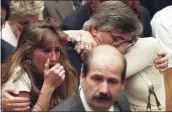  ?? MYUNG J. CHUN — LOS ANGELES DAILY NEWS VIA AP, FILE ?? Fred Goldman, father of Ron Goldman, hugs his wife Patti, as his daughter, Kim, left, reacts during the reading of the not guilty verdicts in O.J. Simpson double-murder trial in Tuesday, Oct. 3,1995, in Los Angeles.