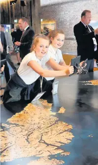  ??  ?? Geography lessons Maddie Harrop and Rhiannon Whyte explore the map of Scotland