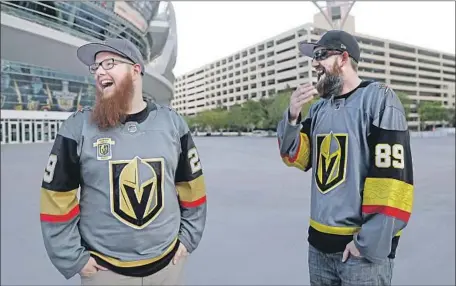  ?? Photograph­s by Isaac Brekken For The Times ?? FANS CHRISTIAN Moreton, left, with Jason Bartholome­w, started placing bets when the Knights were 6 to 1 to win the Stanley Cup.