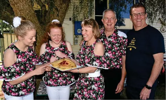  ?? Photo: Alexia Austin ?? BREAKFAST PREP: Sharing a pancake at the breakfast launch are (from left) Naomi, Lauren, Cindy-Jane and Mark Ryan with event co-ordinator Ken Wootton.