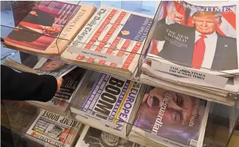  ?? (Toby Melville/Reuters) ?? BRITISH NEWSPAPERS are seen with their reaction to the story of US President-elect Donald Trump at a corner shop in London on November 10.