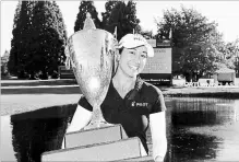  ?? STEVE DYKES THE ASSOCIATED PRESS ?? Golfer Marina Alex holds the trophy after winning the LPGA’sCambia Portland Classic golf tournament in Portland, Ore., on Sunday.