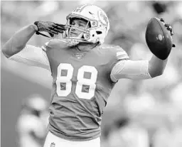  ?? BRYNN ANDERSON/AP ?? Dolphins tight end Mike Gesicki gestures after scoring a touchdown during the second half against the Eagles on Dec. 1 in Miami Gardens.