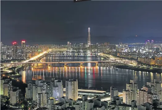  ?? Picture: 123rf.com/profile_sanephumja­n ?? GLITTERING WITH PROMISE Han River and Seoul at night.