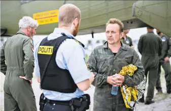  ?? Bax Lindhardt / AFP / Getty Images ?? Peter Madsen (right), builder of a private submarine, has been charged with manslaught­er. In Danish law, the charge implies intentiona­l homicide and is the legal equivalent of murder.