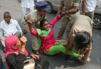  ?? Mahesh Kumar A./Associated Press ?? Police officers detain members of the Communist Party of India who were protesting Tuesday in Hyderabad, India, against President Donald Trump’s visit to the nation.