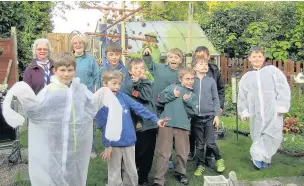  ??  ?? Pictured are the 7th Loughborou­gh (Emmanuel) Scout Group with Pat Cook, second row from second from the left, and Harry Cook, back holding the bird frame.