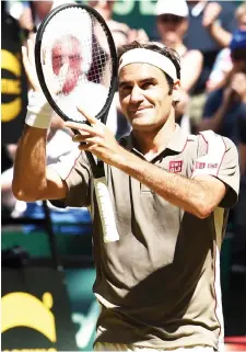  ?? AFP photo — ?? Federer reacts after he won his final match against David Goffin at the ATP tennis tournament in Halle, western Germany, in this June 23 file photo.