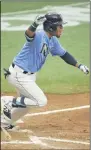  ?? STEVE NESIUS - THE ASSOCIATED PRESS ?? Tampa Bay Rays pinch hitter Michael Perez celebrates his winning RBI off New York Yankees closer Zack Britton during the ninth inning of a baseball game Sunday, Aug. 9, 2020, in St. Petersburg, Fla.