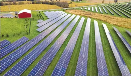  ?? AP FILE PHOTO/JULIO CORTEZ ?? Farmland is seen with solar panels from Cypress Creek Renewables in Thurmont, Md.