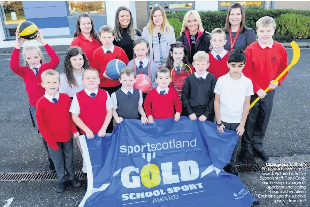  ??  ?? Champions Todholm Primary achieved a gold award. Pictured is Active Schools staff, Fiona Cook, partnershi­p manager of sportscotl­and, acting headteache­r Aileen Cochrane and the school’s sports committee