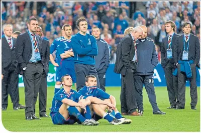  ??  ?? The pain of defeat is obvious for Rangers management and players after the 2008 UEFA Cup Final