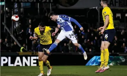  ?? ?? Sion Spence (centre) scores for Bristol Rovers against Oxford United during his side’s 4-3 victory. Photograph: Andy Watts/JMP/Shuttersto­ck