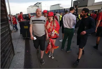  ?? ?? Emotional fans arrive through the gates after enduring terror and panic outside. Photograph: Nick Potts/PA