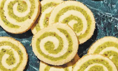  ?? Alex Lau ?? Pistachio pinwheels by Claire Saffitz from her cookbook, “Dessert Person” ( Clarkson Potter).