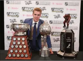  ?? Bridget Bennett ?? Las Vegas Review-journal @bridgetkbe­nnett Last season’s big winner was Edmonton’s Connor Mcdavid, with, from left, the Art Ross Trophy, the Hart Memorial Trophy and the Ted Lindsay Award.