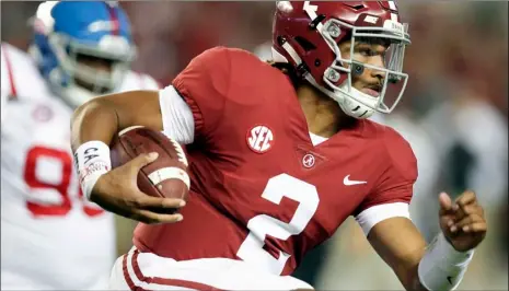  ??  ?? In this Sept. 30 file photo, Alabama quarterbac­k Jalen Hurts runs the ball against Mississipp­i during the first half of an NCAA college football game in Tuscaloosa, Ala. The Southeaste­rn Conference doesn’t have any players putting up video game-style...