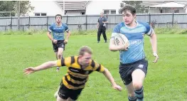  ??  ?? Score John McLaren runs in for his second try of the afternoon