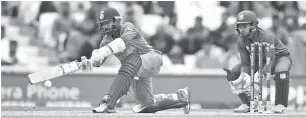  ??  ?? India’s Dinesh Karthik in action during a ICC Champions Trophy warm-up match against Bangladesh at The Oval in London. — Reuters photo