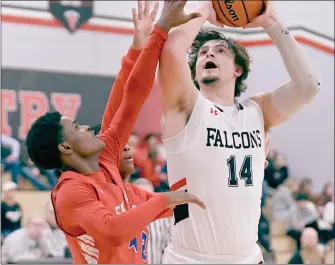  ?? PILOT PHOTO/BEV HARAMIA ?? John Glenn’s Brycen Hannah shoots over a South Bend Adams defender in the January matchup between the two teams.