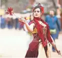  ?? ANYA MAGNUSON/THE REPUBLIC ?? Krista Denewell performs with juggling sticks at the Arizona Renaissanc­e Festival on Feb. 9, 2019, in Gold Canyon. This year’s event has been canceled.