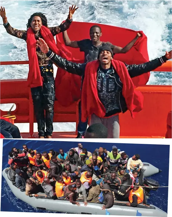  ??  ?? Operation rescue: Jubilant African migrants (main picture) aboard Captain Miguel Parcha’s vessel, the Guardamar Polimnia (above left), as holiday-makers sunbathe. Above, migrants packed into a dinghy wait to be plucked to safety