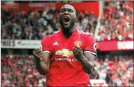  ?? DAVE THOMPSON / AP ?? Romelu Lukaku exhorts Old Trafford fans after netting the first of his two goals in Manchester United’s 4-0 Premier League victory over West Ham on Sunday.