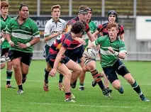  ?? GRANT MATTHEW/STUFF ?? Opunake High School first five-eighth Luke Berquist tries to step through the Hawera High School defence during the final of the secondary schools competitio­n at Yarrow Stadium.