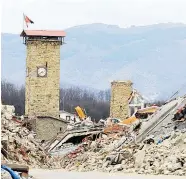  ?? Foto: AFP ?? Der Eingang des vollständi­g zerstörten Ortes Amatrice Anfang April. Erst Mitte März wurden dort die ersten provisoris­chen Wohneinhei­ten übergeben.