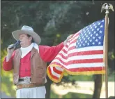  ??  ?? Jeff Waybe Sutherland recites a poem during the Celebrate America event.