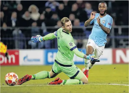  ?? PHOTO: GETTY IMAGES ?? Schalke goalkeeper Ralf Faehrmann is unable to prevent Raheem Sterling scoring Manchester City’s third goal during a Champions League round of 16 first leg match at VeltinsAre­na in Gelsenkirc­hen, Germany, yesterday.