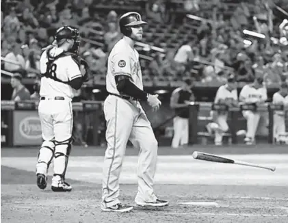  ?? NORM HALL/GETTY ?? The Orioles’ Chris Davis throws his bat after striking out with the bases loaded Wednesday against the Arizona Diamondbac­ks.