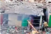  ?? ?? Unverified footage, above, appears to show Wagner soldiers throwing grenades into a house defended by Ukrainian troops. Right, firefighte­rs work at a power substation hit by a Russian missile strike in Lviv