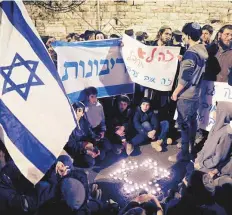  ?? Reuters ?? Right wing Israelis hold a candleligh­t protest outside the Israeli Prime Minister’s residence in Occupied Jerusalem.