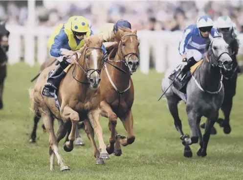  ??  ?? 0 Ryan Moore on board Dream Of Dreams, left, on their way to winning the Diamond Jubilee Stakes at Royal Ascot on Saturday