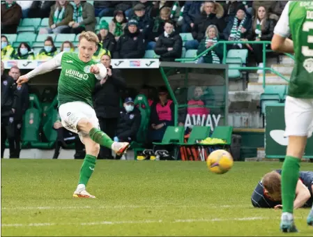  ?? ?? Jake Doyle-Hayes scores the opener for Hibs yesterday