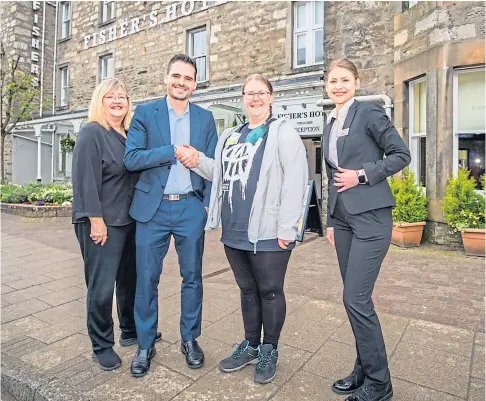  ?? ?? HELP: Susan Isaacs (reception manager), Daniel Santana (depute manager), Marigold Massie (of Pitlochry and Moulin Heritage Centre) and Bohdana Tonanva (guests manager) at Fisher’s Hotel. Pitlochry. Picture by Steve MacDougall.