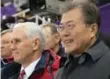  ?? CARL COURT/GETTY IMAGES ?? U.S. Vice-President Mike Pence sat as Olympic fans applauded the Koreas’ joint team of athletes.
