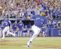  ??  ?? TORONTO: Toronto Blue Jays’ Edwin Encarnacio­n celebrates after his two-RBI double against the Cleveland Indians during the seventh inning in Game 4 of baseball’s American League Championsh­ip Series in Toronto, Tuesday. — AP