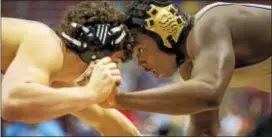  ?? NATE HECKENBERG­ER — FOR DIGITAL FIRST MEDIA ?? Upper Darby’s Brian Kennerly, right, goes against Parkland’s Nathan Feyrer Friday at the PIAA Class 3A wrestling championsh­ips. Kennerly, wrestling at 220 pounds, defeated Feyrer via major decision for the celebrity Royal’s 100th career victory.