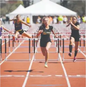  ??  ?? Faith Christian’s Sarah Yocum races to victory Sunday in the Class 3A girls 100meter hurdles. Her winning time was 14.36. Helen H. Richardson, The Denver Post