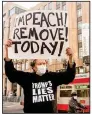  ?? (AP/Noah Berger) ?? Kenneth Lundgreen stands Monday outside Twitter headquarte­rs in San Francisco with a sign calling for President Donald Trump’s removal from office.